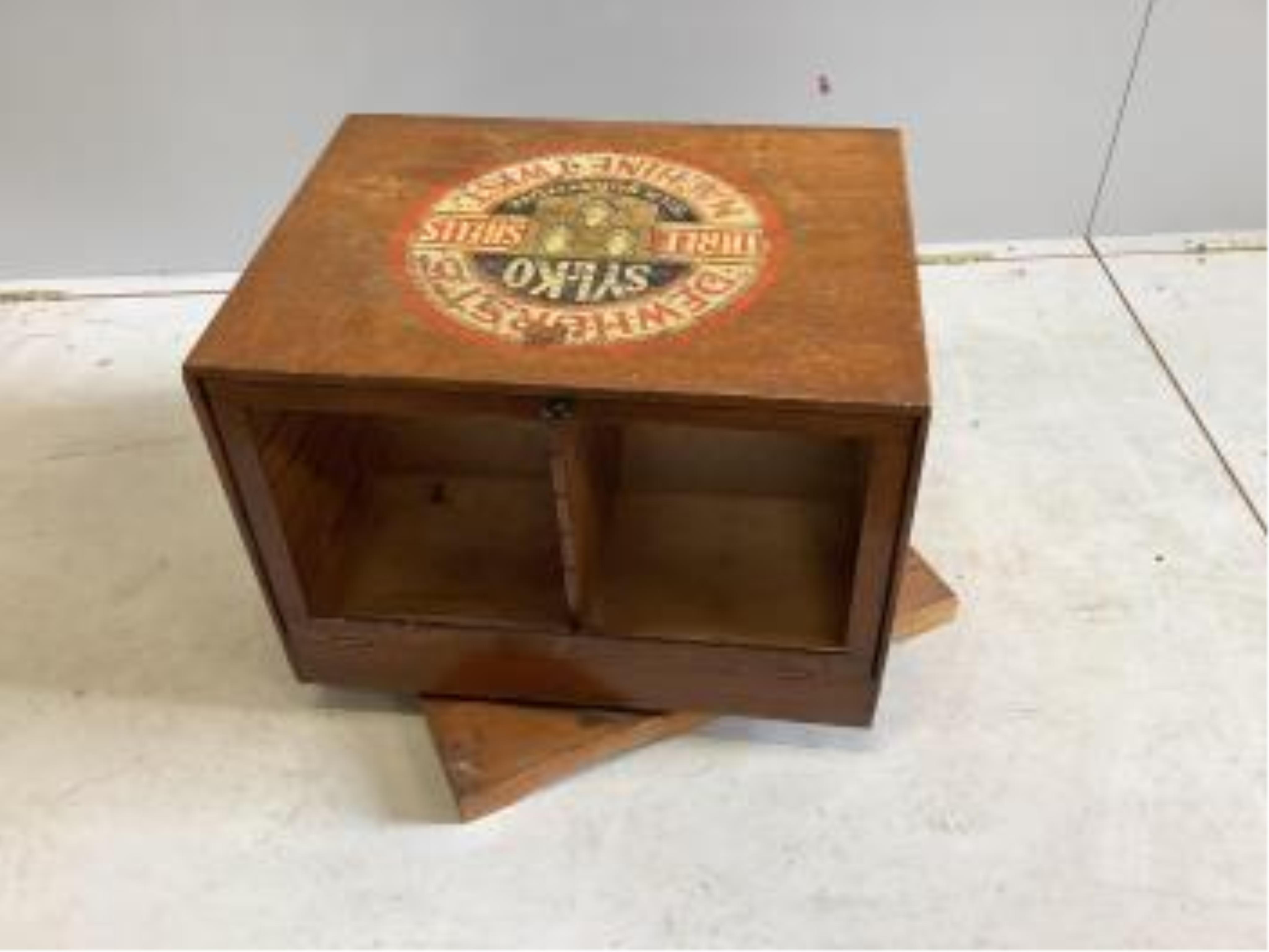 An early 20th century oak counter top display case, 'Dewhursts Sylko three shells machine twist' on revolving base, width 54cm, depth 53cm, height 43cm. Condition - fair